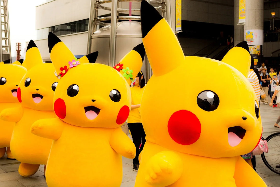 A crowd of people in Pikachu costumes, yellow with red cheeks and long pointed ears, dancing in a street parade in Japan